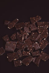 Broken dark chocolate bars. View from above.chocolate background
