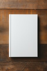 Blank book cover mockup, hardcover mock up of business literature on wood desk, office table. Top view