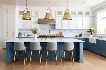 A beautiful modern kitchen with blue cabinets, gold hardware and glass lights hanging above the large island.