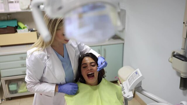 Young woman making sure her teeth are healthy