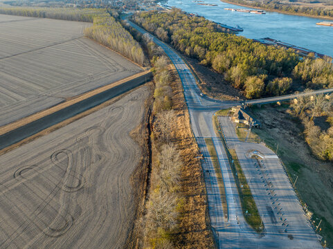 highway and Ohio River with barges below Cairo Illinois, November aerial view
