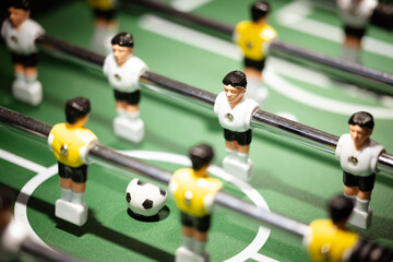 Macro of players on a Foosball table 