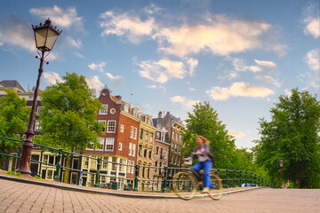 Motion blurred biker in Amsterdam - 687694148