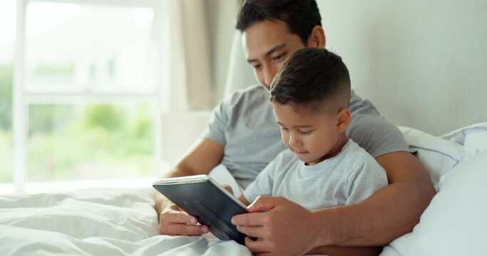 Dad, kid and tablet in bedroom for online storytelling, multimedia games or reading ebook. Man, father and child relax in morning with digital technology, streaming cartoon or watching movies at home