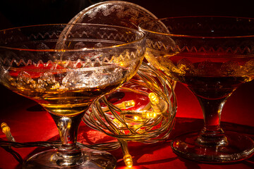 Vintage champange glasses for holiday celebration with festive lights