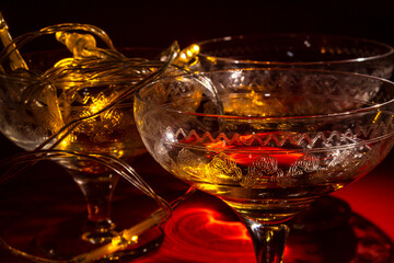 Vintage champange glasses for holiday celebration with festive lights