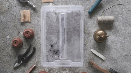 Top view of insert box with handle, surrounded by craft tools.