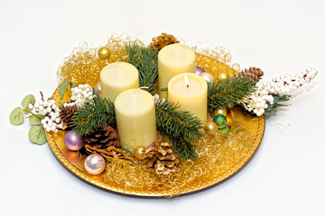 Advent wreath with burning candle on white backgroung - 687698780