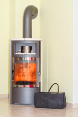 Modern wood burning stove in a living room - 687698785