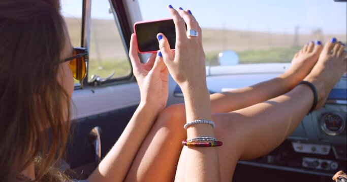 Travel, car and woman with phone on road trip taking pictures, selfies and photo for social media. Adventure, freedom and girl in motor vehicle enjoying summer vacation, holiday and weekend getaway