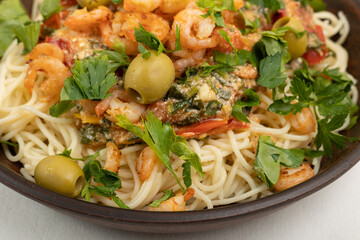 Pasta with shrimp and vegetables close-up