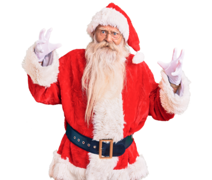Old senior man with grey hair and long beard wearing traditional santa claus costume shouting frustrated with rage, hands trying to strangle, yelling mad