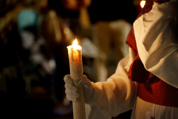 A penitent with his candle on the holy night