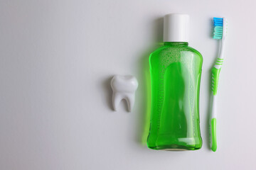 A mouthwash on a colored background. Dental care, dental health.