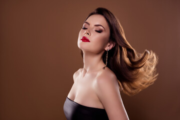 Fototapeta premium Photo of classy attractive lady turning head hair fluttering after applying shampoo for festive party