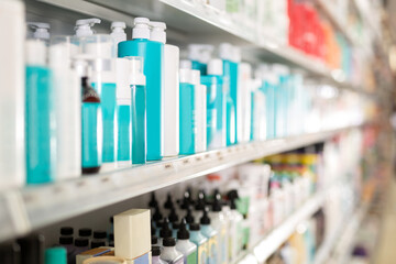 Different haircare cosmetics for sale on shelves of cosmetic shop