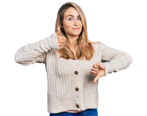 Young blonde woman wearing casual clothes doing thumbs up and down, disagreement and agreement expression. crazy conflict