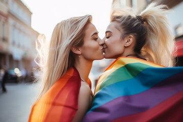 Happy woman kissing girl with rainbow flag wearing on city street, LGBT motivation.generative ai