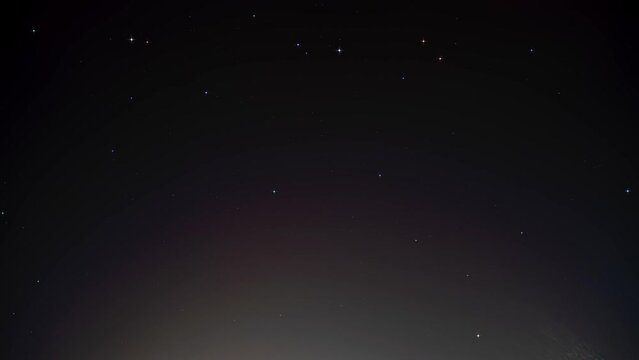Night time lapse of stars. Astro time-lapse in North America. Light polluted area downtown.