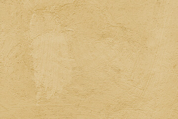 Old stucco plaster surface, brushstroke background, close up grunge texture of yellow painted...