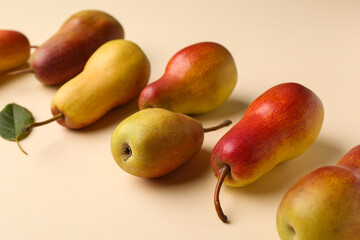 Ripe pears on yellow background