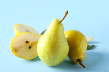 Ripe pears on blue background