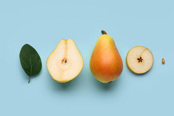 Ripe pears on blue background