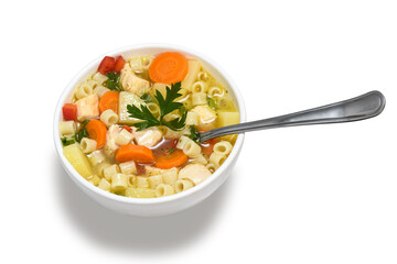 chicken soup with vegetables in a white bowl with a spoon