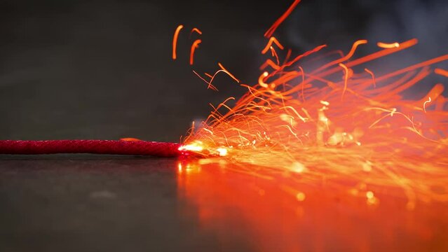 A macro shot of a burning fuse.