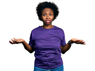 African american woman with afro hair wearing casual purple t shirt clueless and confused with open...