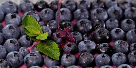 blueberries and leaves close-up on background. High quality photo