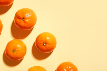 Sweet mandarins on yellow background