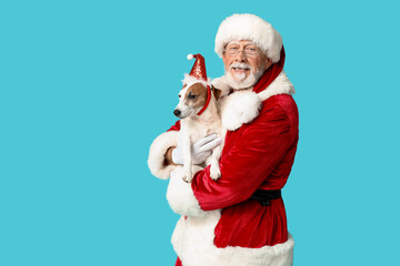 Santa Claus with cute Jack Russell Terrier dog on blue background