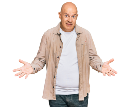 Middle age bald man wearing casual clothes clueless and confused expression with arms and hands raised. doubt concept.