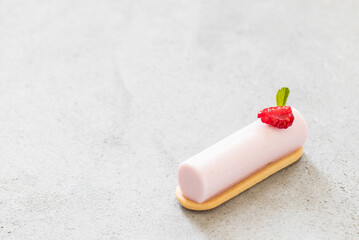 Vegan Raspberry cream dessert bar. On cookie. Light grey background. Copy space