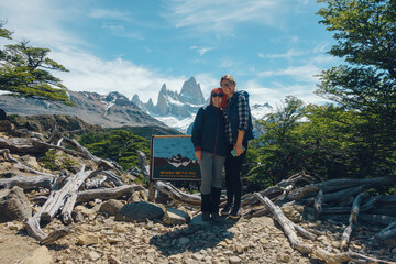 two girls posing, fitroy mountain in the back