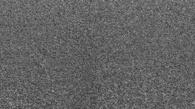 black spongy foam material surface texture background porous and fine grain