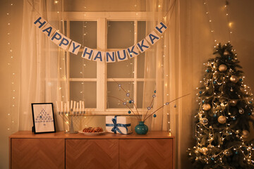 Wooden cabinet with traditional Hanukkah decorations and bunting at home