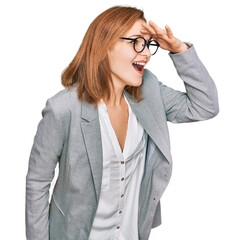 Young caucasian woman wearing business style and glasses very happy and smiling looking far away...