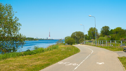 road in the park, photo of the park in summer, road, trees and river © fotofotofoto