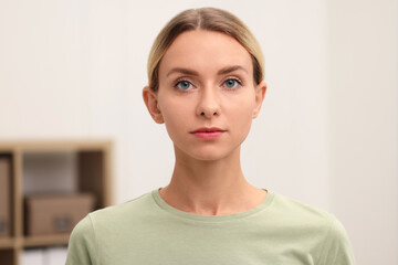 Portrait of beautiful woman against blurred background