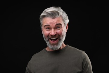 Personality concept. Portrait of emotional man on black background