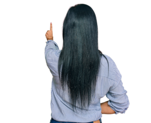 Young caucasian woman wearing casual clothes posing backwards pointing ahead with finger hand