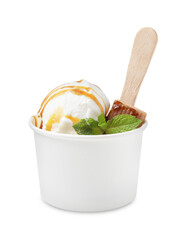 Tasty ice cream with caramel sauce, mint leaves and candy in paper cup isolated on white