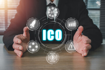 ICO, Initial Coin Offering concept, Businessman hand holding Initial Coin Offering icon on virtual...