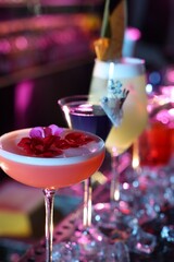 Different fresh alcoholic cocktails on counter in bar