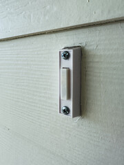 A standard doorbell on a new home