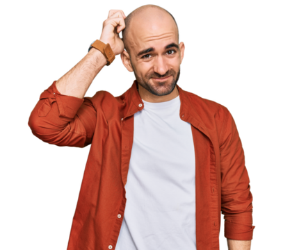 Young hispanic man wearing casual clothes confuse and wonder about question. uncertain with doubt, thinking with hand on head. pensive concept.