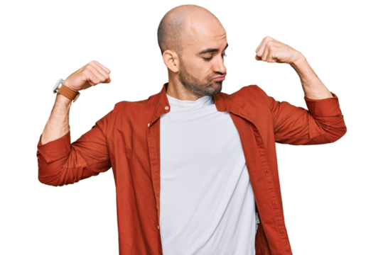 Young hispanic man wearing casual clothes showing arms muscles smiling proud. fitness concept.