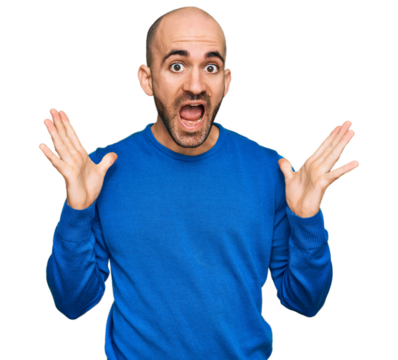 Young hispanic man wearing casual clothes celebrating crazy and amazed for success with arms raised and open eyes screaming excited. winner concept